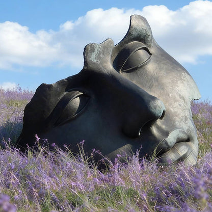 Bronze Sleeping Face Sculpture in Lavender Field
