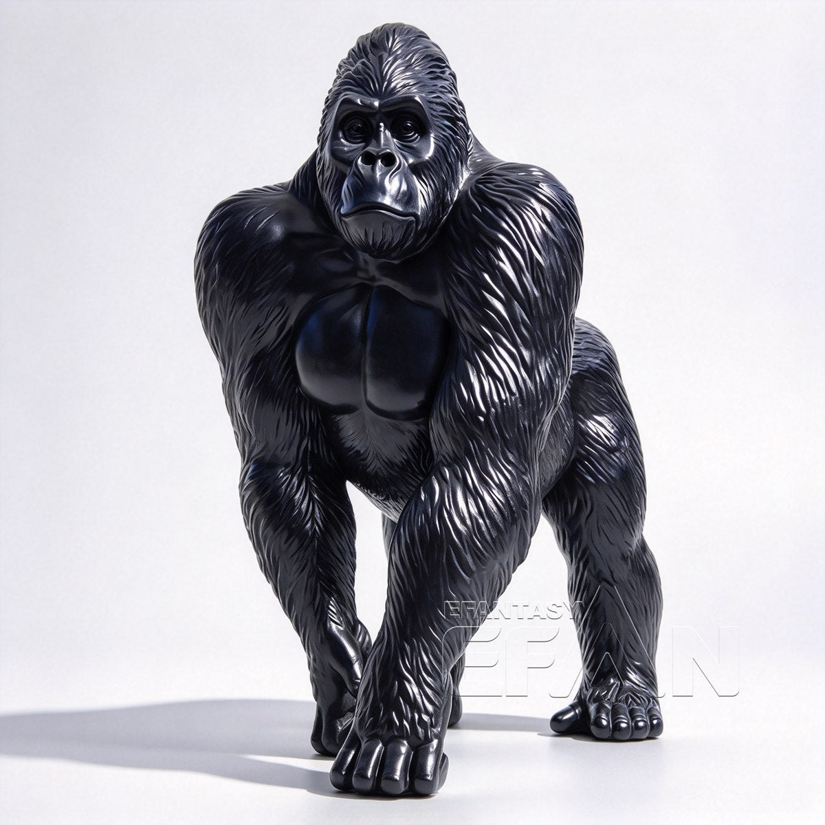 Front view of life-size black bronze gorilla sculpture on white background
