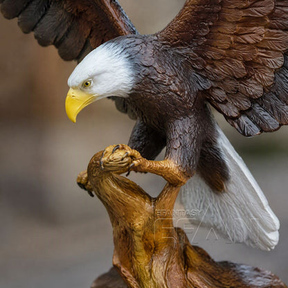 Close-up of bronze bald eagle sculpture showing yellow beak, feathers, and talons